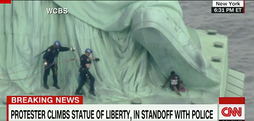 Woman Arrested on 4th of July After Climbing the Base of the Statue of Liberty in Protest of Migrant Family Separations