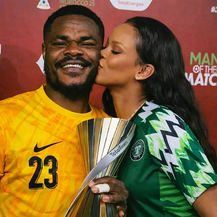 American music star Rihanna was spotted pecking Stanley Nwabalis cheek after he won the Man of the...